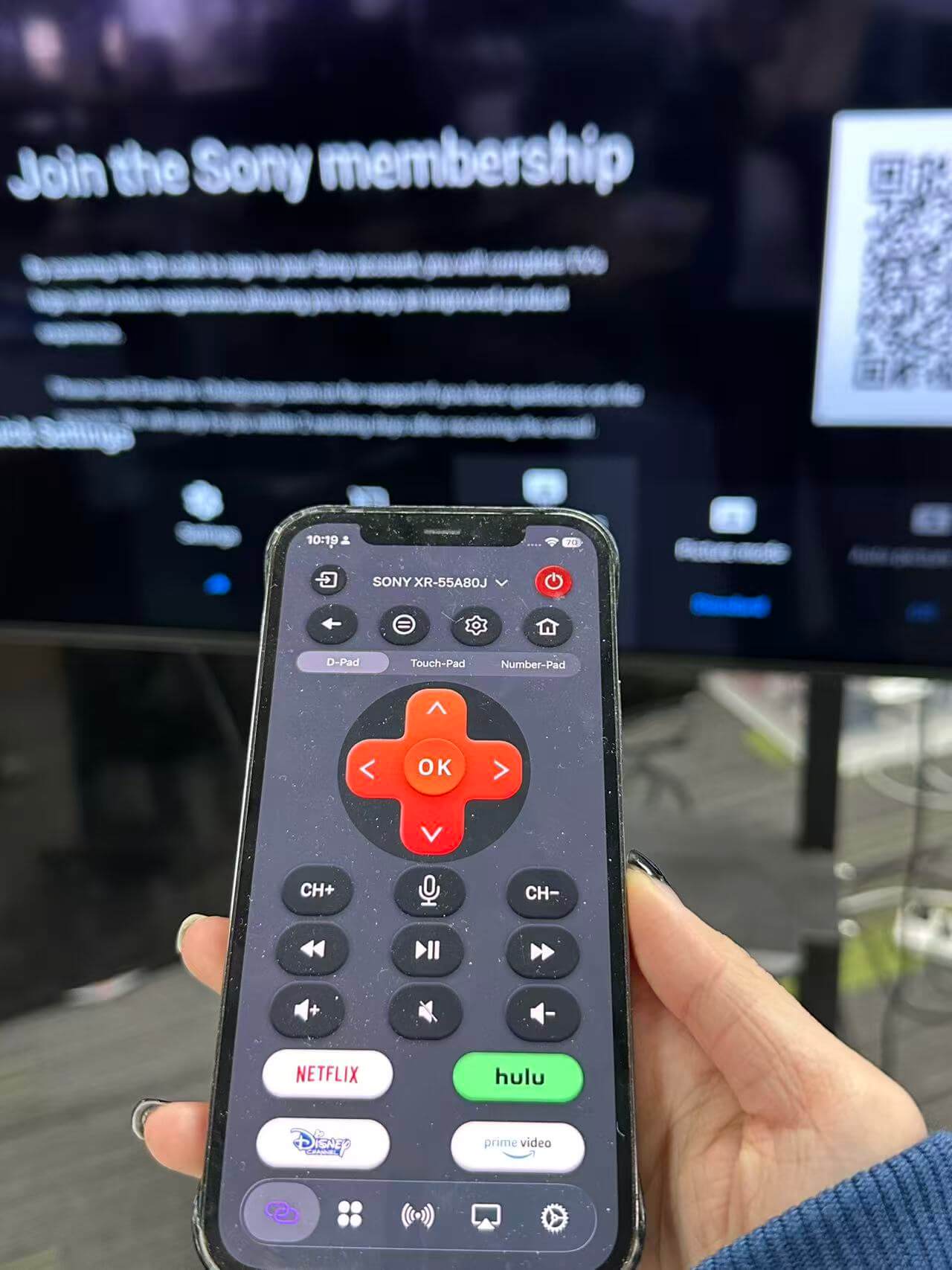 iPhone using a remote app to control a TV